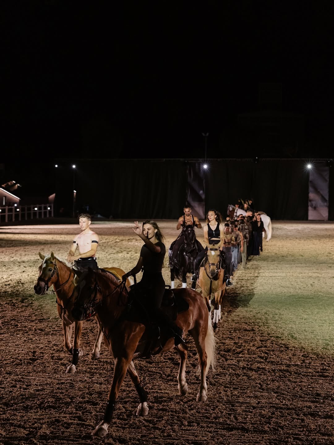 Equestrian show at Issa Resort - riders entering the arena at night